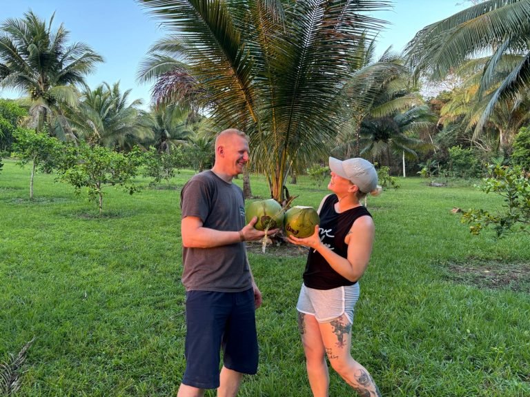 Guests enjoying fresh coconuts at The Cabins at Monkey Falls